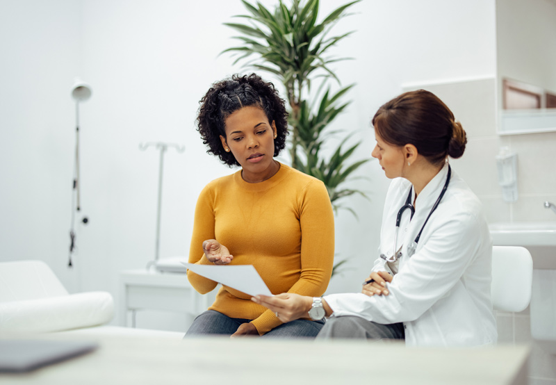 Female-physician-discussing-treatment-for-cystitis-with-female-patient