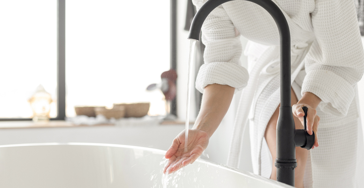 Woman-preparing-bath-to-manage-symptoms-of-urethral-prolapse